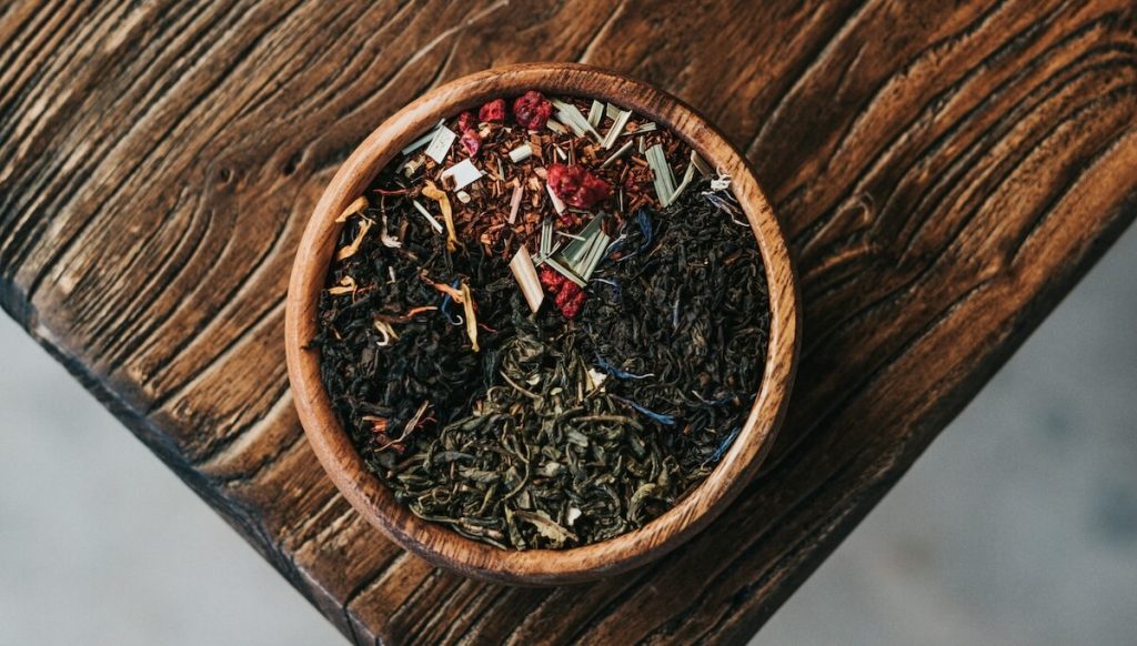 a bowl filled with different herbs